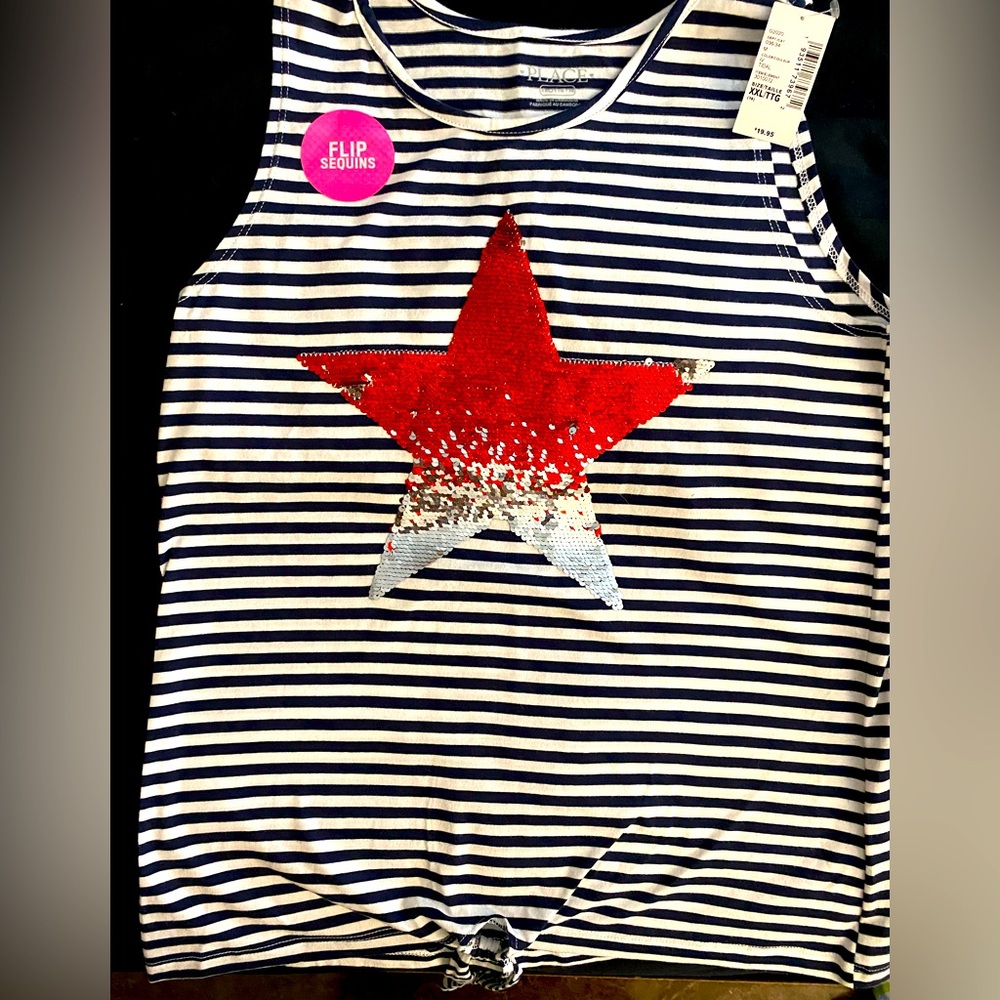Black and white stripe with red and silver reversible sequence star on the front